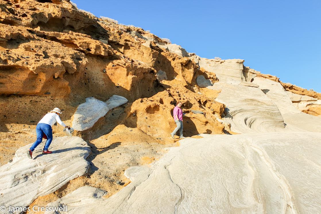 A photograph of fossilized sand dunes (pale) onto of bright yellow palagonite tuff of the Amarilla cone, Tenerife