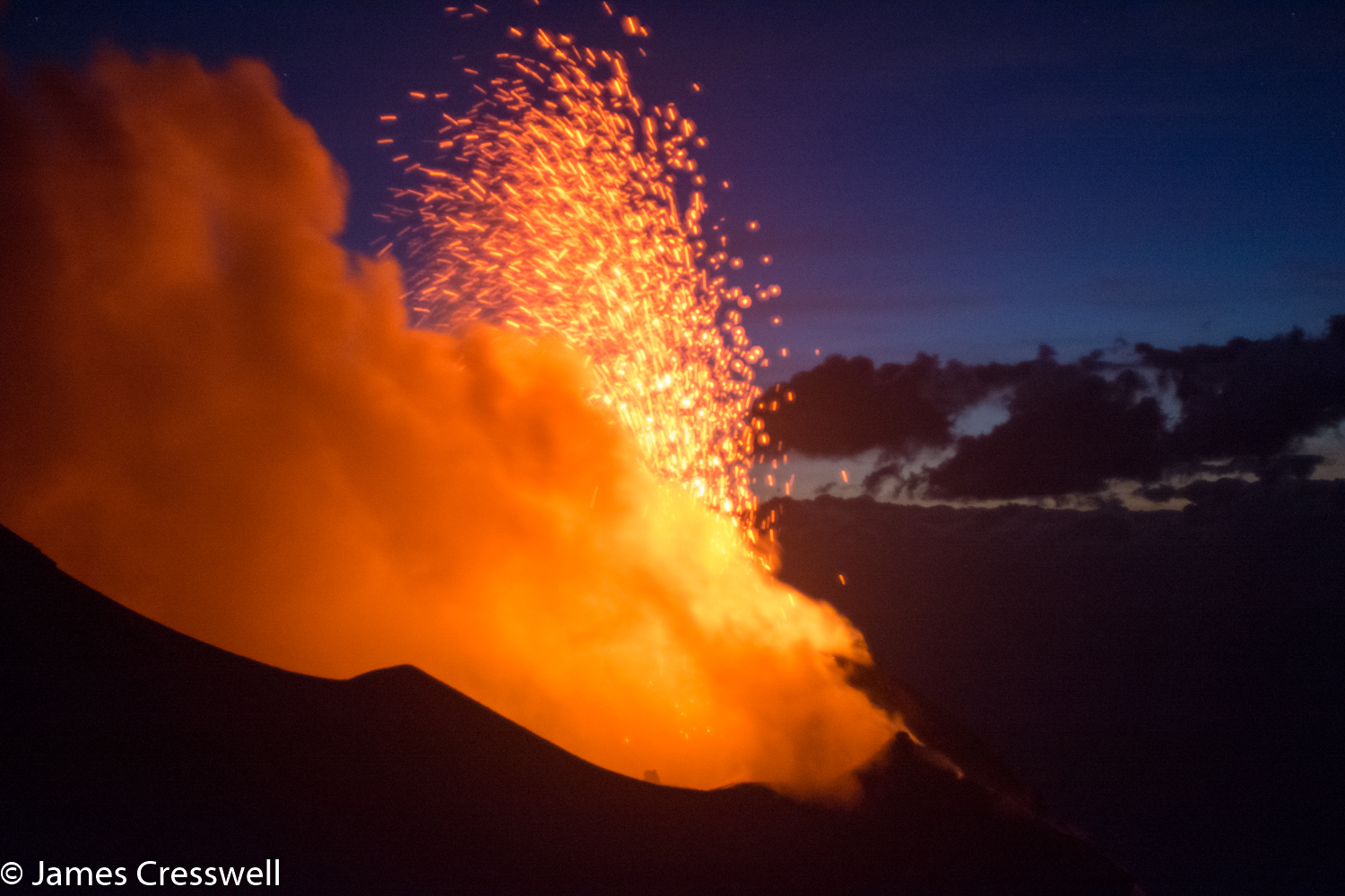 A photgraph of an erupting volcano, Stromboli, taken on a GeoWorld Travel volcano and geology trip and holiday