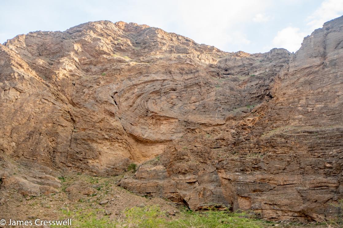 A photograph of part of the world's largest sheath fold, taken on the GeoWorld Travel Oman geology holiday