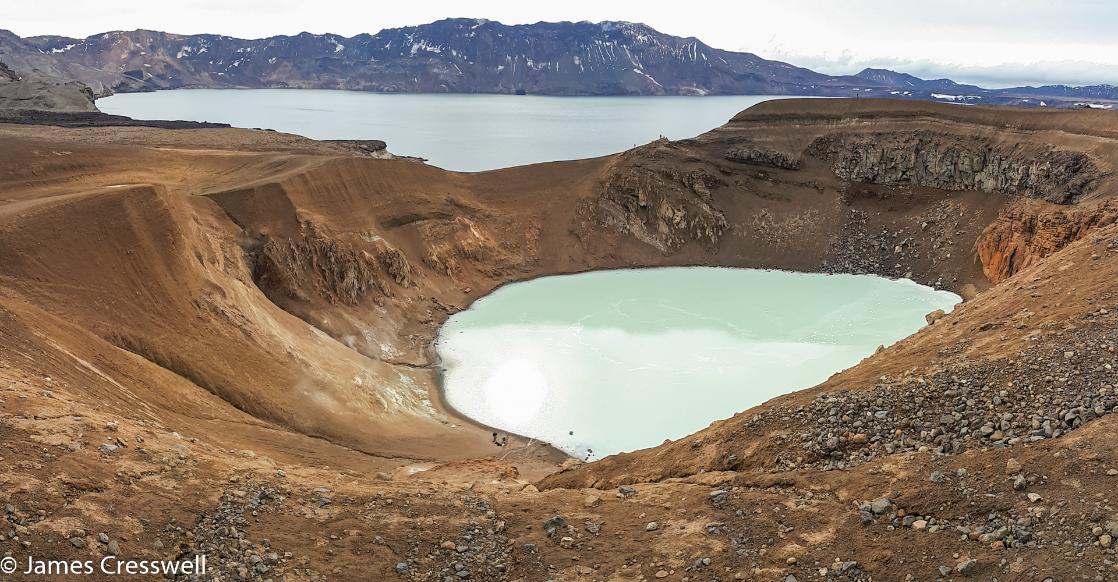 A photograph of two volcanic craters that contain lakes, Askja volcano, taken on a GeoWorld Travel geology trip and volcano holiday