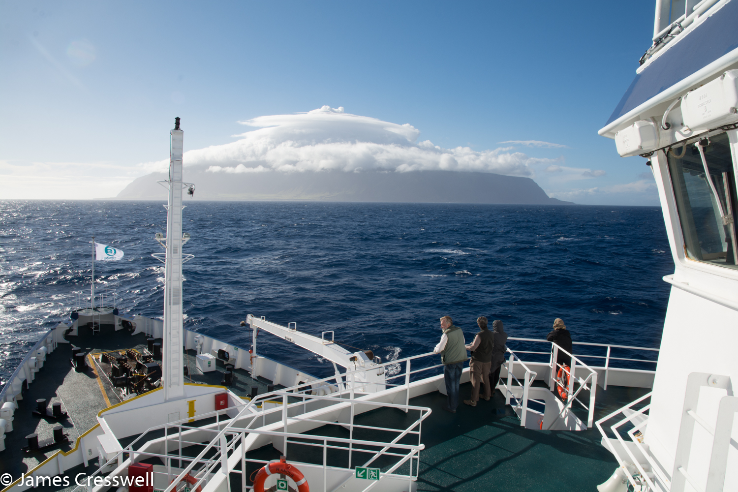 A photograph from a ship as it approaches a volcanic island, Tristan da Cunha, taken on a PolarWorld Travel placed cruise
