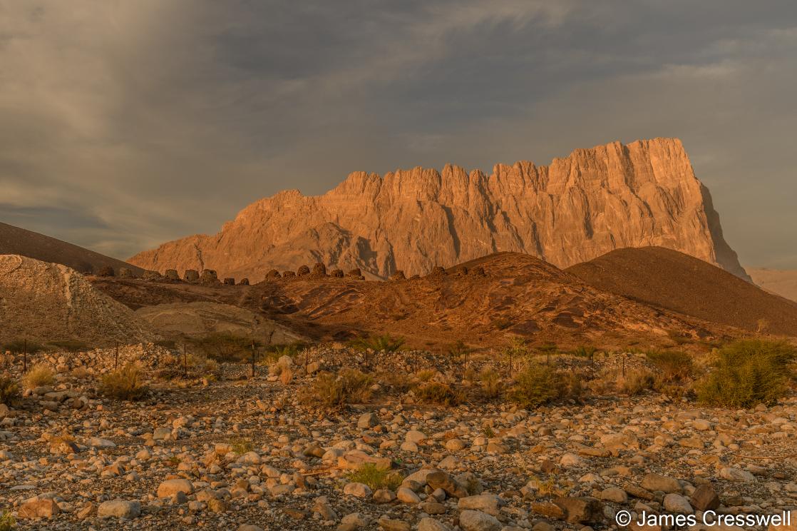 A photograph of Jebel Misht and Al Ayn beehive tombs taken on an Oman geology tour