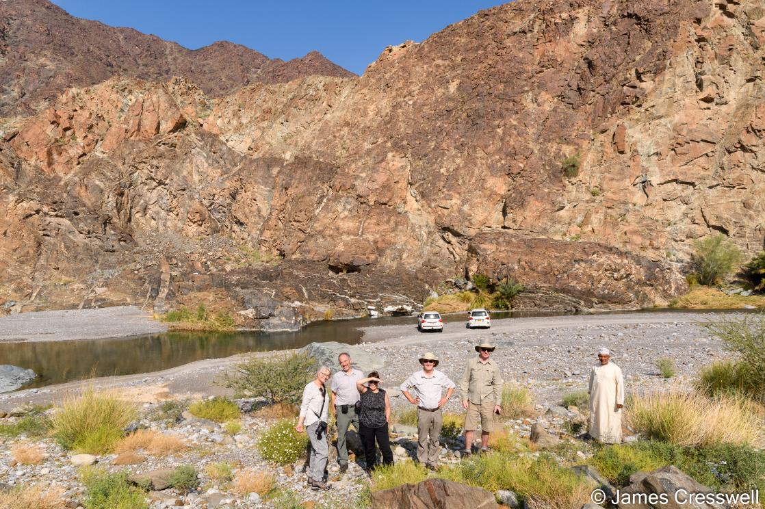 A photograph of a GeoWorld Travel group at the Moho in Oman