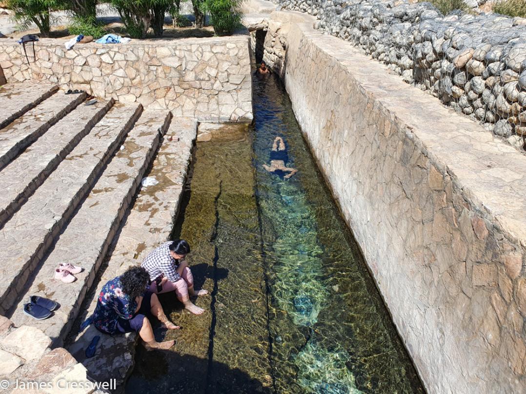 A photograph of an irrigation canal in the Aflaj Irrigation System of Oman World Heritage Site, taken on a GeoWorld Travel Oman geology trip, tour and holiday