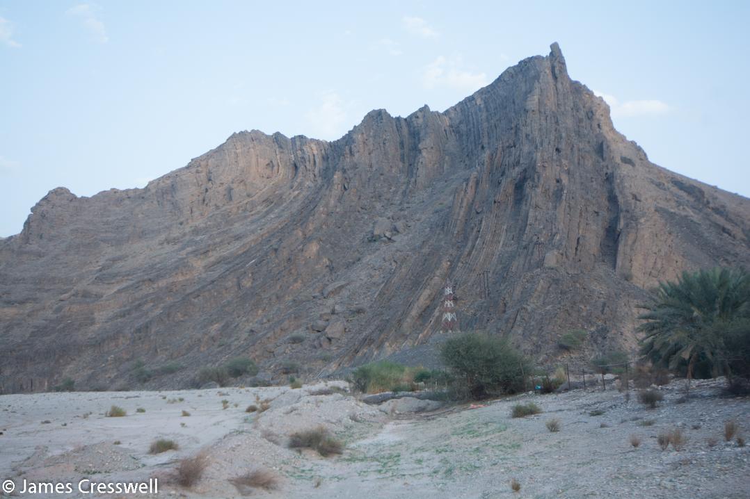 A photograph of large fold in a mountain side, taken on a GeoWorld Travel Oman geology trip, tour and holiday