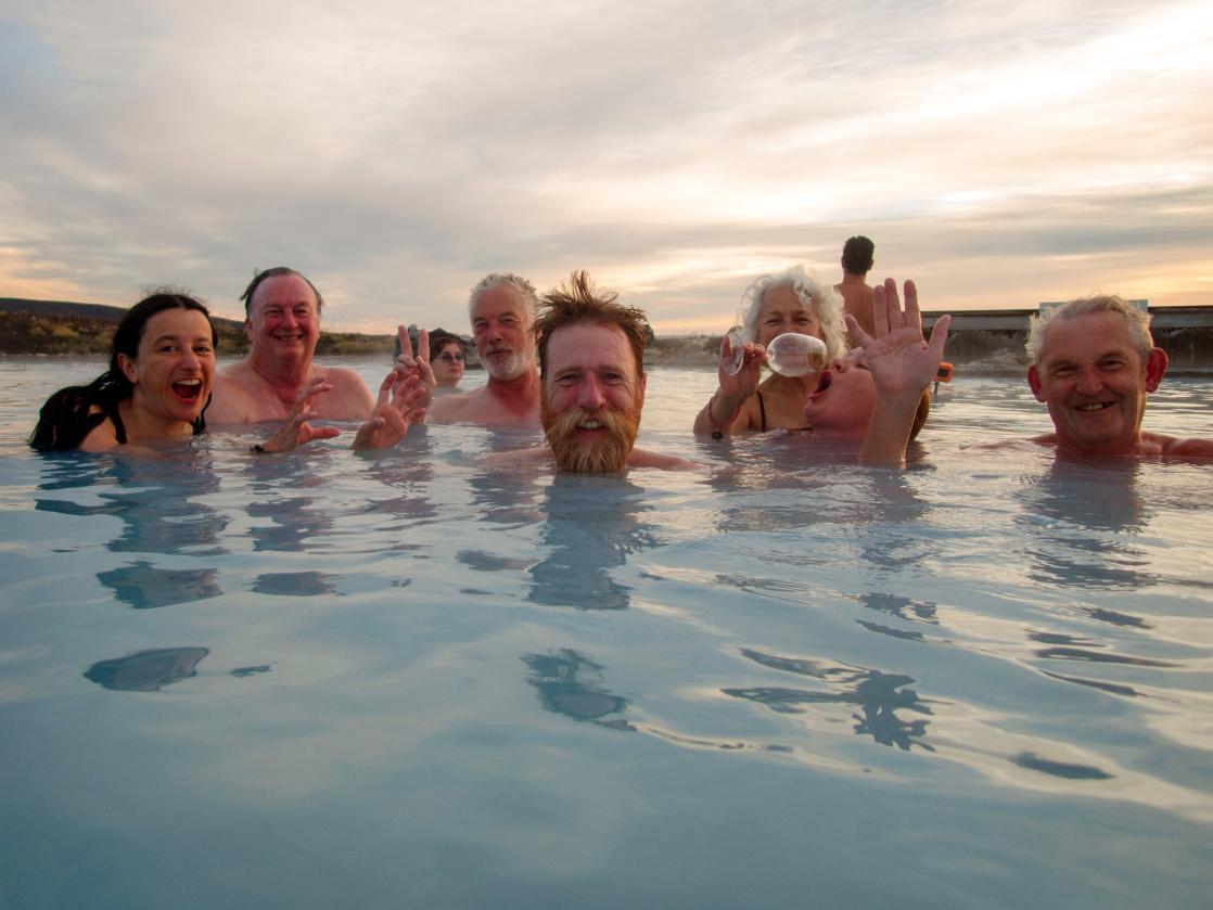 A photograph of a GeoWorld Travel group at the Mývatn Nature Baths, Iceland