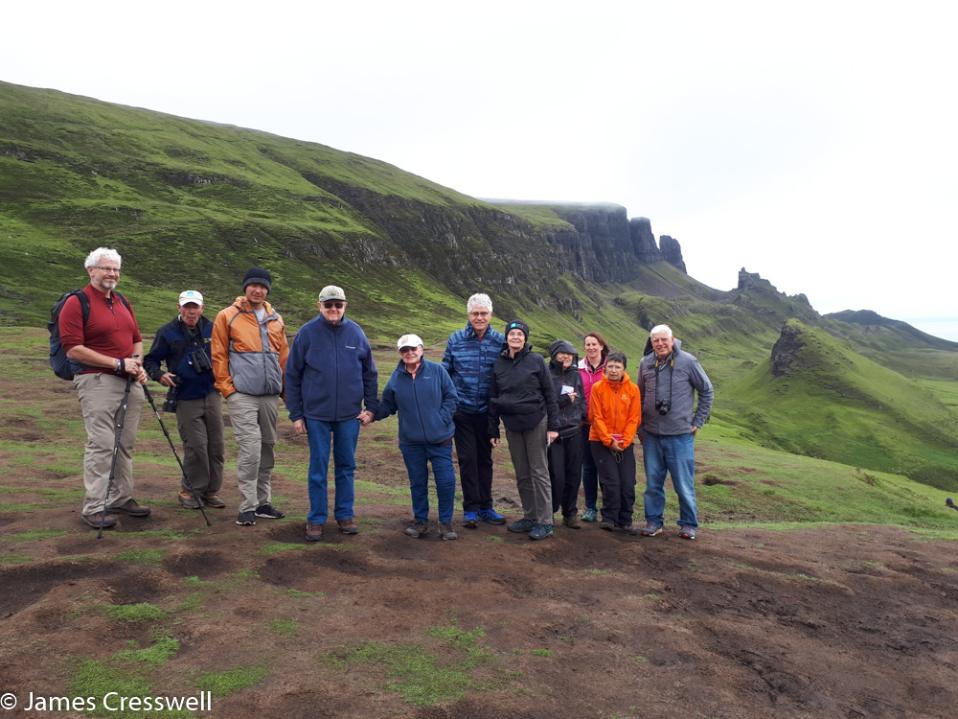 A group photo of the participants of the 2019 GeoWorld Travel Scotland Geology tour at the Quirang, Isle of Skye 