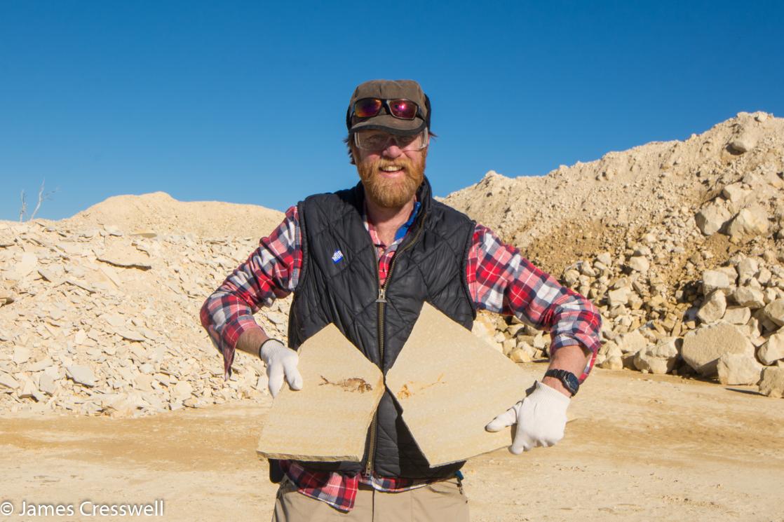 A photograph of James Cresswell with a Green River Formation fossil fish, taken on a GeoWorld Travel USA geology trip, tour and holiday